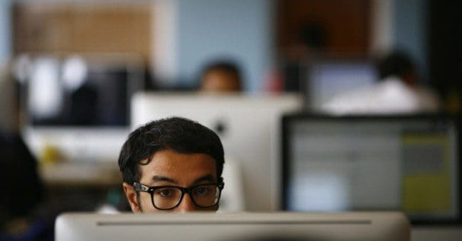 Employee works on his computer at the office of CloudFactory, a Canadian startup that based itself in Kathmandu