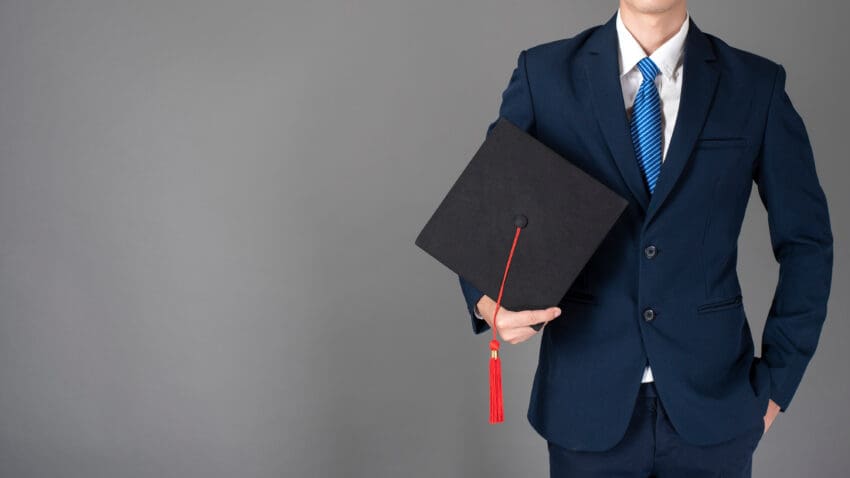 Business,Man,Is,Holding,Graduation,Hat,,Business,Education,Concept