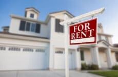 Red,For,Rent,Real,Estate,Sign,In,Front,Of,Beautiful