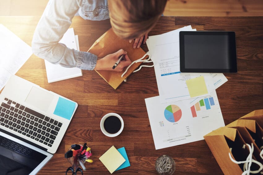 Young,Female,Entrepreneur,Working,In,A,Home,Office,At,Her